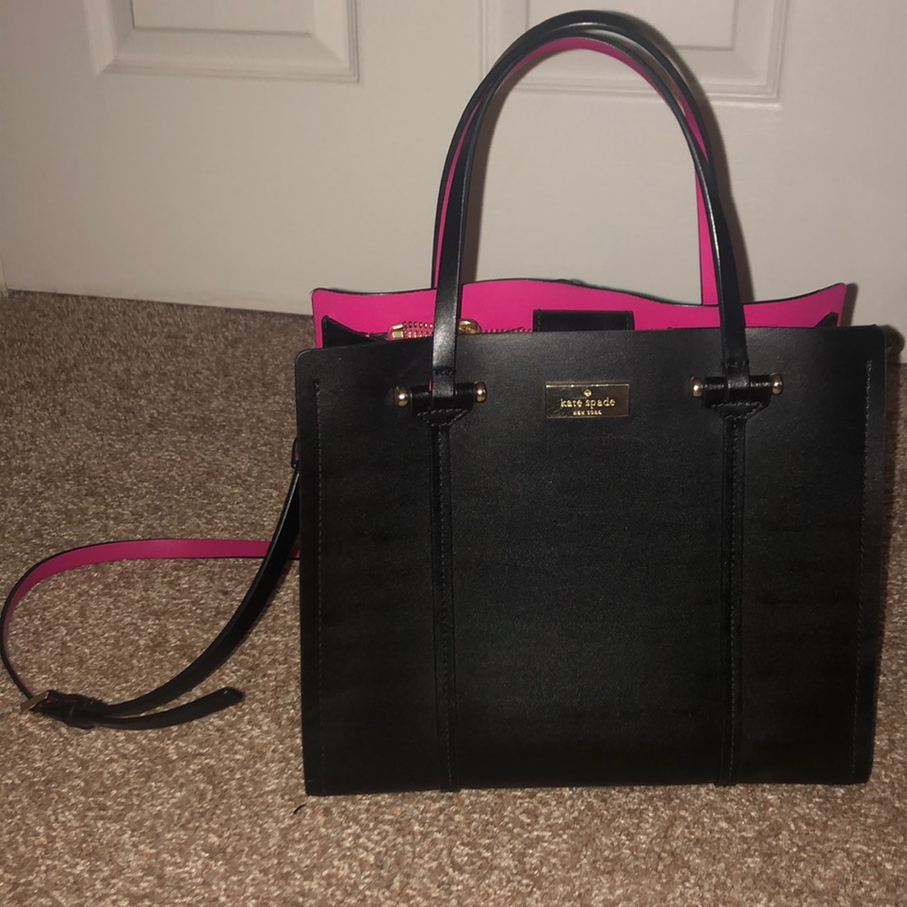 Black Kate Spade purse with pink interior